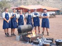 The guide team cooking up an awesome meal in the camp ovens |  <i>Chris Buykx</i>