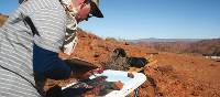 Leo Robba painting in the outback | Leo Robba