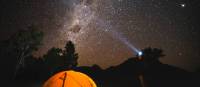 The night sky filled with bright stars over Australia's only Dark Sky Park in the Warrumbungles. | Destination NSW