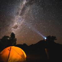 The night sky filled with bright stars over Australia's only Dark Sky Park in the Warrumbungles. | Destination NSW