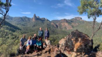 Enjoying the magical Warrumbungles from Macha Tor, with the Breadknife and the Belougery Spire in the background.

