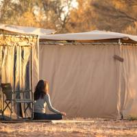 Relaxing in front of our spacious Larapinta In Comfort tents | #cathyfinchphotography