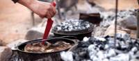 Cooking on hot coals at Camp Fearless | Guy Wilkinson