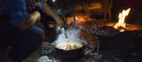 The Larapinta Guides still cook with traditional camp ovens over an open fire | Caroline Crick