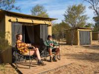 Trekkers relaxing on the porch of their campsites |  <i>Shaana McNaught</i>