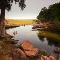 Relaxing in the waterhole above Gunlom Waterfall on the Kakadu Walking Adventure | Rhys Clarke