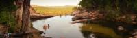 Relaxing in the waterhole above Gunlom Waterfall on the Kakadu Walking Adventure |  <i>Rhys Clarke</i>