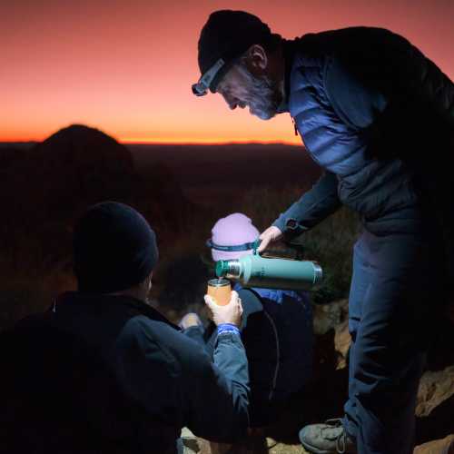 Enjoying a hot cuppa on top of Mt Sonder at sunrise