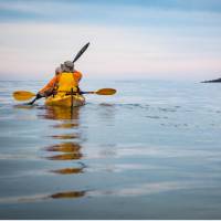 Kayakers enjoying the tranquility of Bruny Island, Tasmania