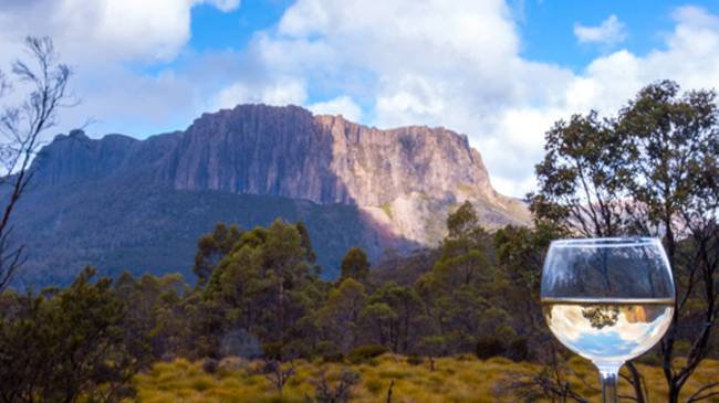 Enjoy a glass of wine after a day's trek along the Overland Track | Great Walks of Australia