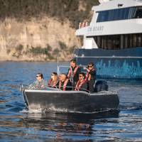 Expedition vessel Odalisque and guests in one of two excursion tenders