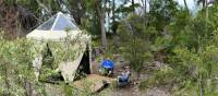 Hikers putting up their feet at our coastal Eco-Comfort Camp | Michael Buggy