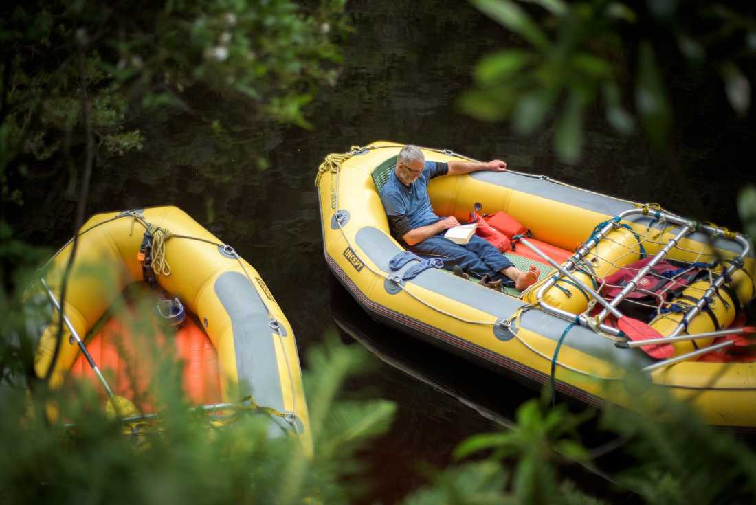 Rafter reading a book in the raft | Glenn Walker