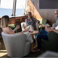 Guests relaxing in expedition vessel Odalisque's Wheelhouse Lounge & Bar