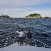 Guide & guest island spotting from the bow of Odalisque