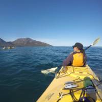 Kayaking on Coles Bay, with the Hazards in the distance | Brad Atwal