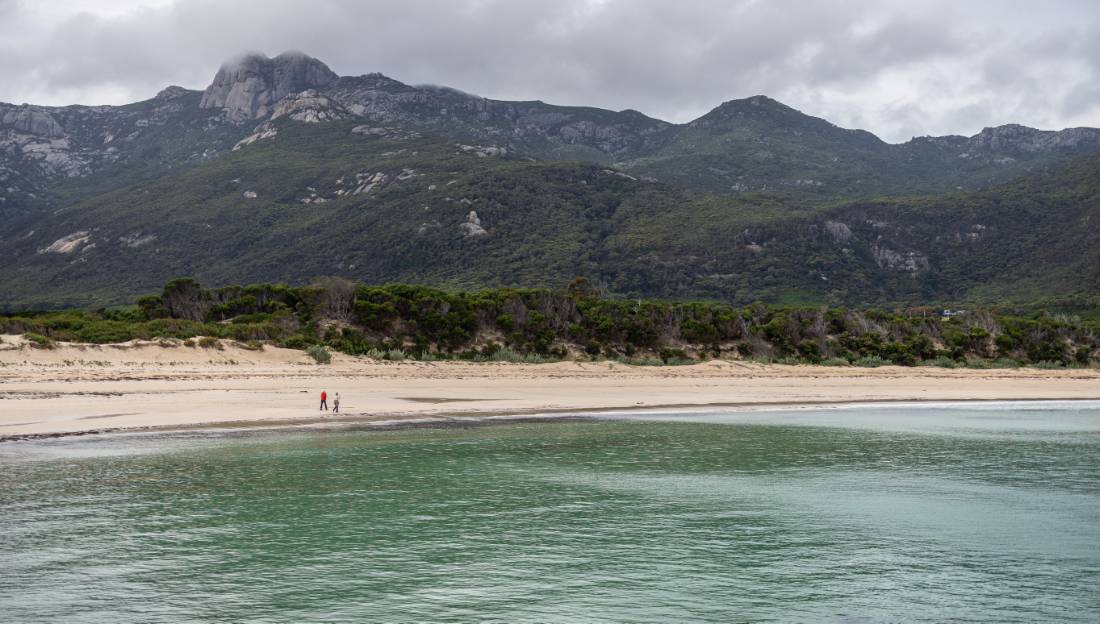 Walking along the pristine sands of a Flinders Island beach