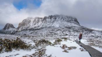 Hiker on the Overland Track in winter | Luke Tscharke