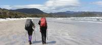 A couple treks the remote beaches along the South Coast Track | Phil Wyndham