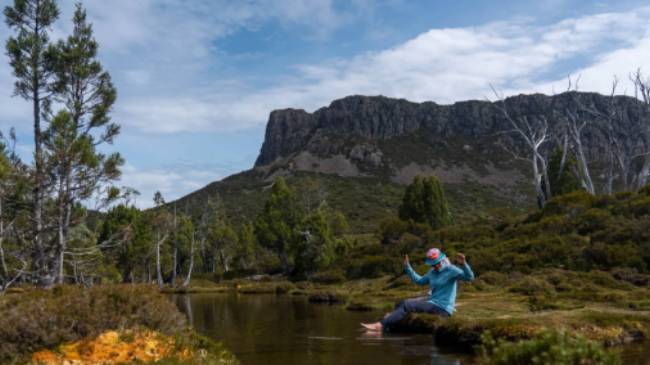 Relaxing by a stream in Walls of Jerusalem National Park. | Benny Plunkett