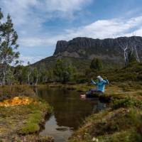 Relaxing by a stream in Walls of Jerusalem National Park. | Benny Plunkett