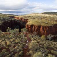 Wander down into ancient deep gorges of layered red rock at Karijini National Park | Tourism Western Australia