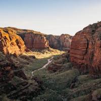 Embark on an exhilarating trek through the rugged terrain of Piccaninny Creek bed, immersing yourself in the exploration of the remote and spectacular gorge network. | Tourism Western Australia