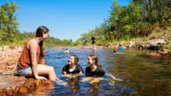 Kids cooling off during a walk in Kakadu National Park