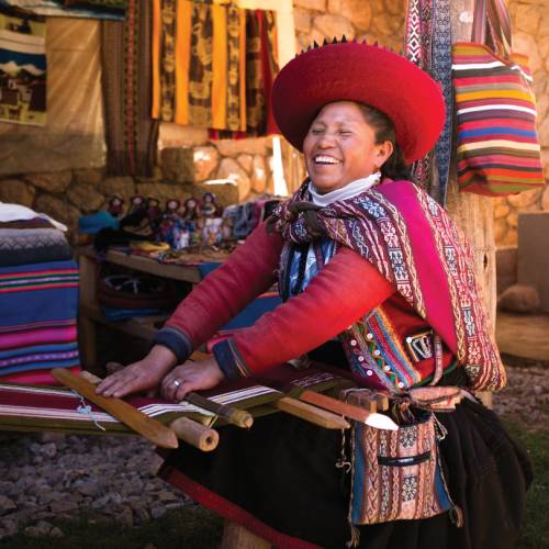Quechua woman backstrap weaving in Chinchero