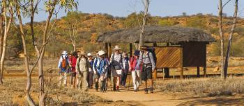 Trekkers embarking at the beginning of the Larapinta Trail, the old Telegraph Station | Peter Walton