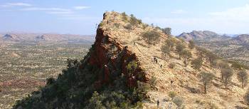 Trekkers ascending the ridge along the Larapinta Trail