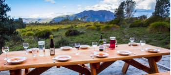 Delicious meals and wine are served each evening on the Cradle Huts walk | Great Walks of Australia