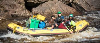 Guides navigating the raft to calmer waters | Glenn Walker